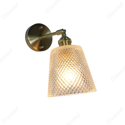 glass wall sconce, detail view of fixture base and arm