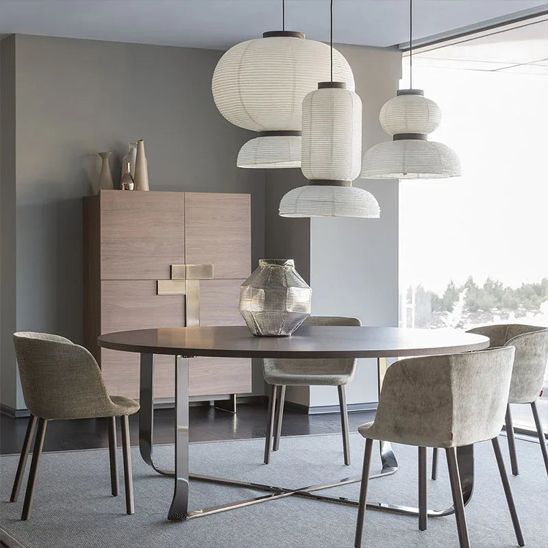 Textured rice paper shade on a cord pendant chandelier in cold white light