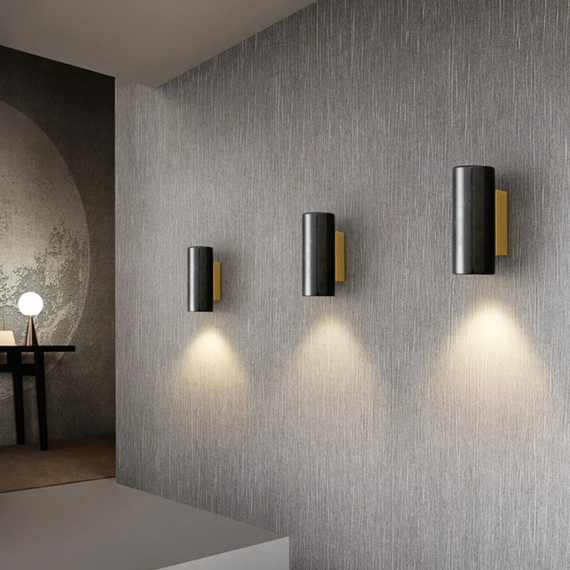 black marble wall sconce, installed in a room interior setting