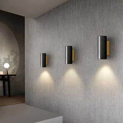 black marble wall sconce, installed in a room interior setting