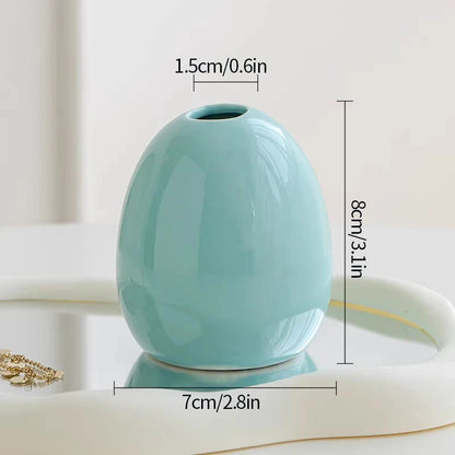 Ceramic bud vase set styled for boho wedding reception table