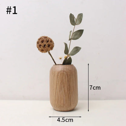 Overhead view of Japanese wooden flower desk vase with fresh slim branch inside