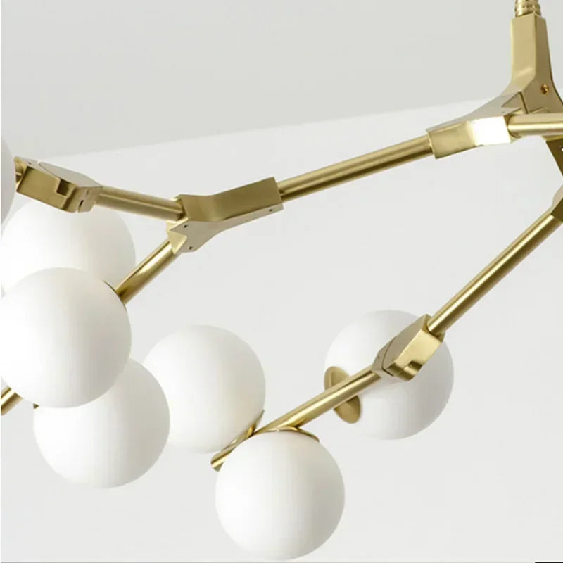 Gold finish glass ball branch chandelier in a molecular pattern