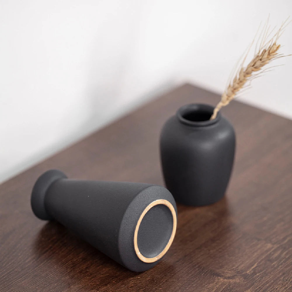 Style E small frosted ceramic vase with eucalyptus sprig on a minimalist side table