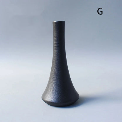 Japanese ceramic small vase with single dried eucalyptus branch inside
