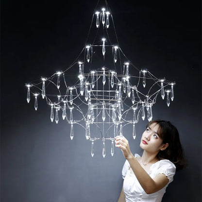 Art deco crystal chandelier radiating from a polished chrome central hub