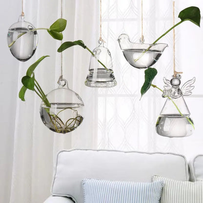 Birds shaped hanging glass vase for hydroponic display in a bright window