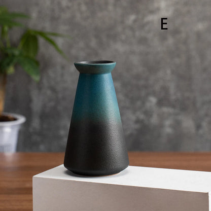 Overhead view of small frosted matte ceramic vase with fresh lavender sprig inside