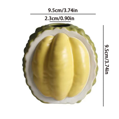 Overhead view of ceramic orange fruit vase showing wide opening top