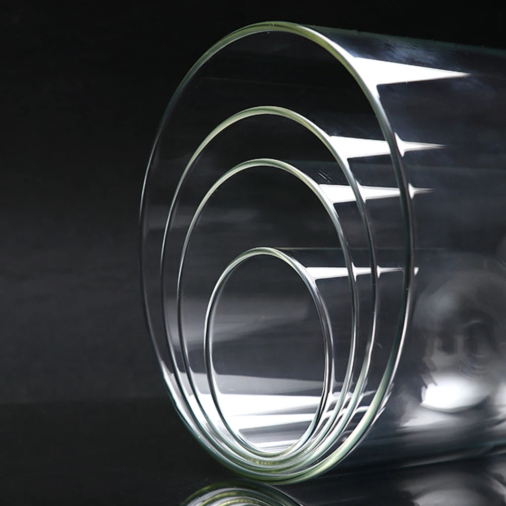 Glass dome display cover with wooden base on desk