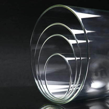 Glass dome display cover with wooden base on desk