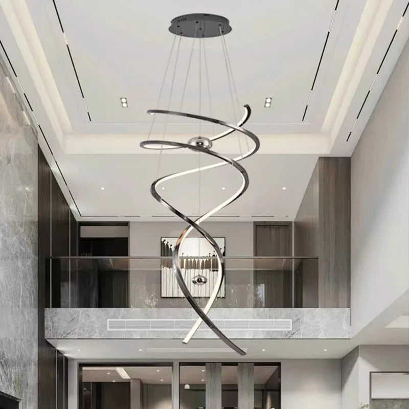 Geometric staircase chandelier in gold with cascading iron and steel frames