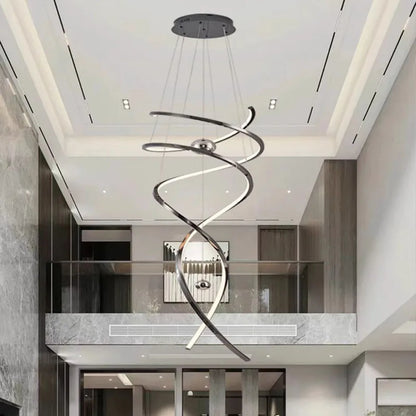Geometric staircase chandelier in gold with cascading iron and steel frames