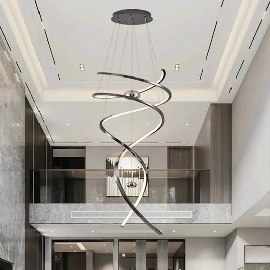 Geometric staircase chandelier in gold with cascading iron and steel frames