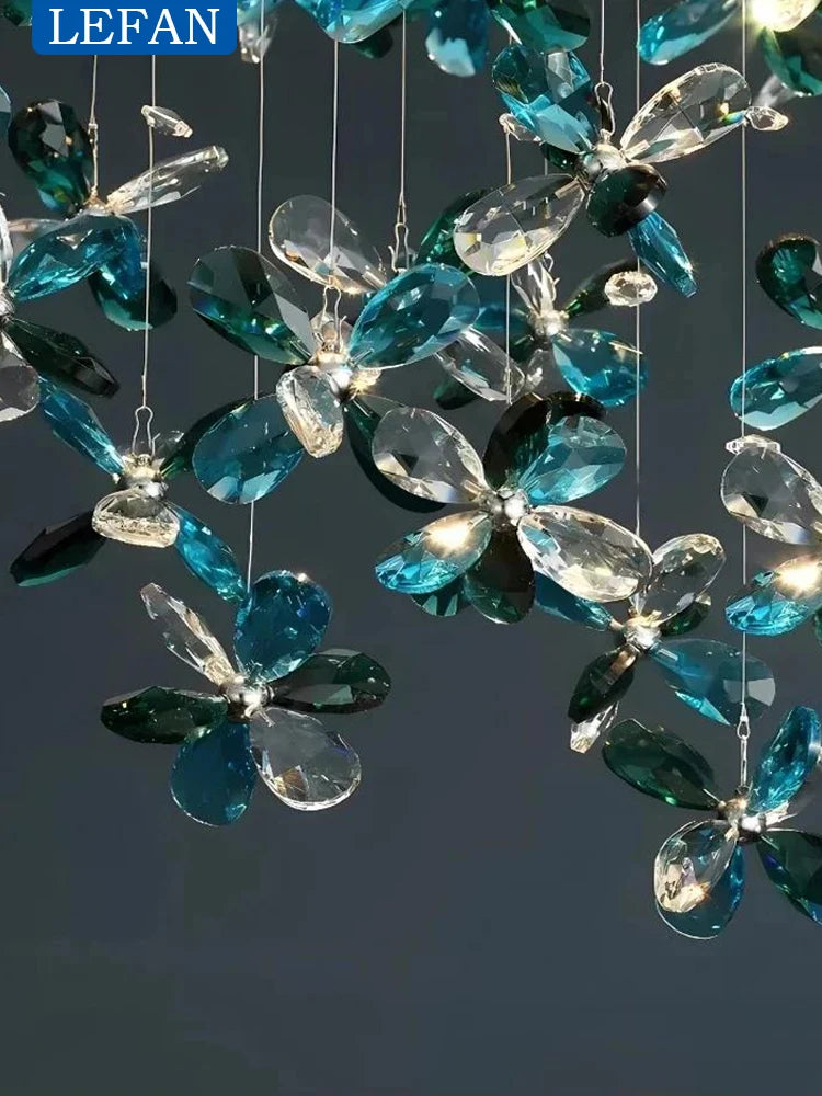 Oval crystal chandelier shown lit in warm white GU10 LED light