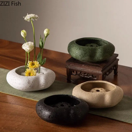 Lotus seedpod ceramic vase with artificial flower arrangement
