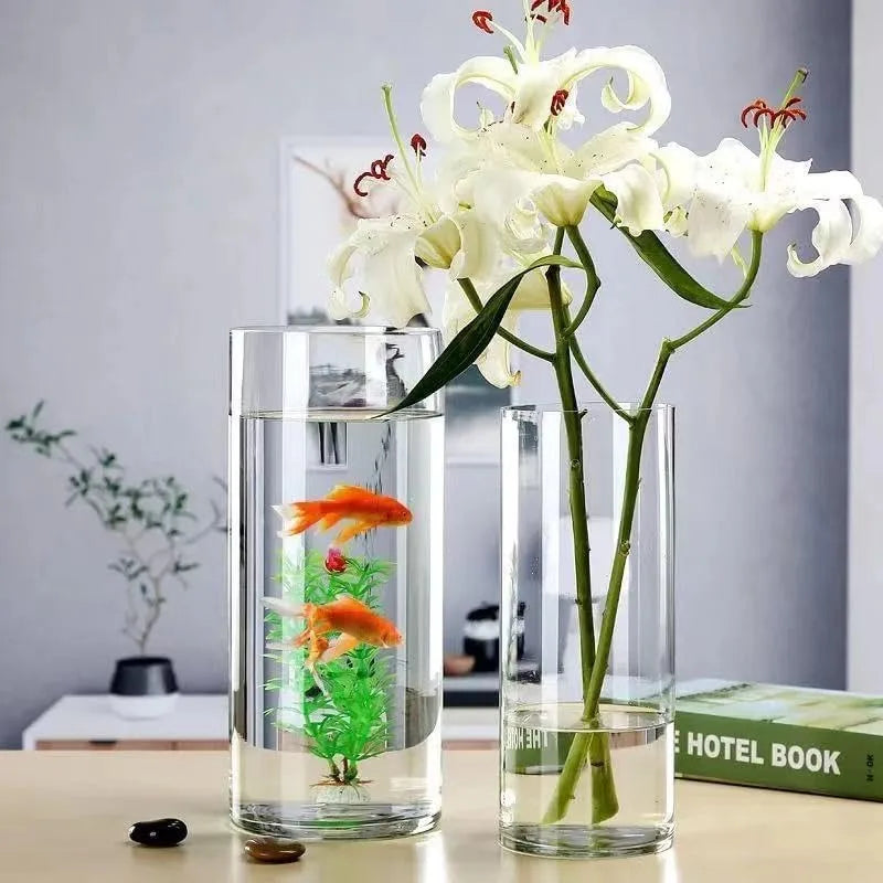 Three clear acrylic cylinder vases small medium large