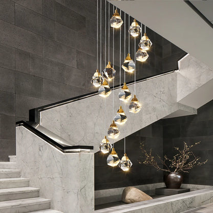 Crystal dining chandelier lit in warm white above a long table