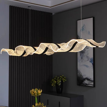 Curved linear chandelier in gold with an iron frame and PMMA shade