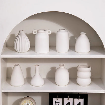 Nordic white ceramic mini vase on white shelf display