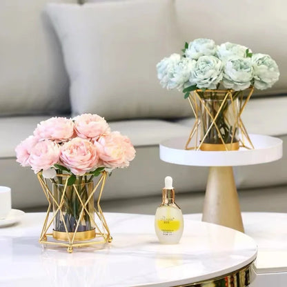 Gold iron geometric glass vase with eucalyptus stems for minimalist table decor