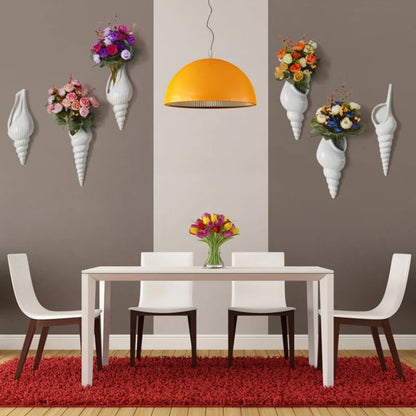 Three orientation styles of white ceramic conch wall vase displayed together