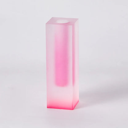 Purple-pink frosted acrylic vase styled in modern Nordic living room setting