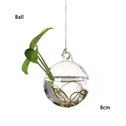 Birds glass hanging vase styled at a boho wedding as hanging floral decor