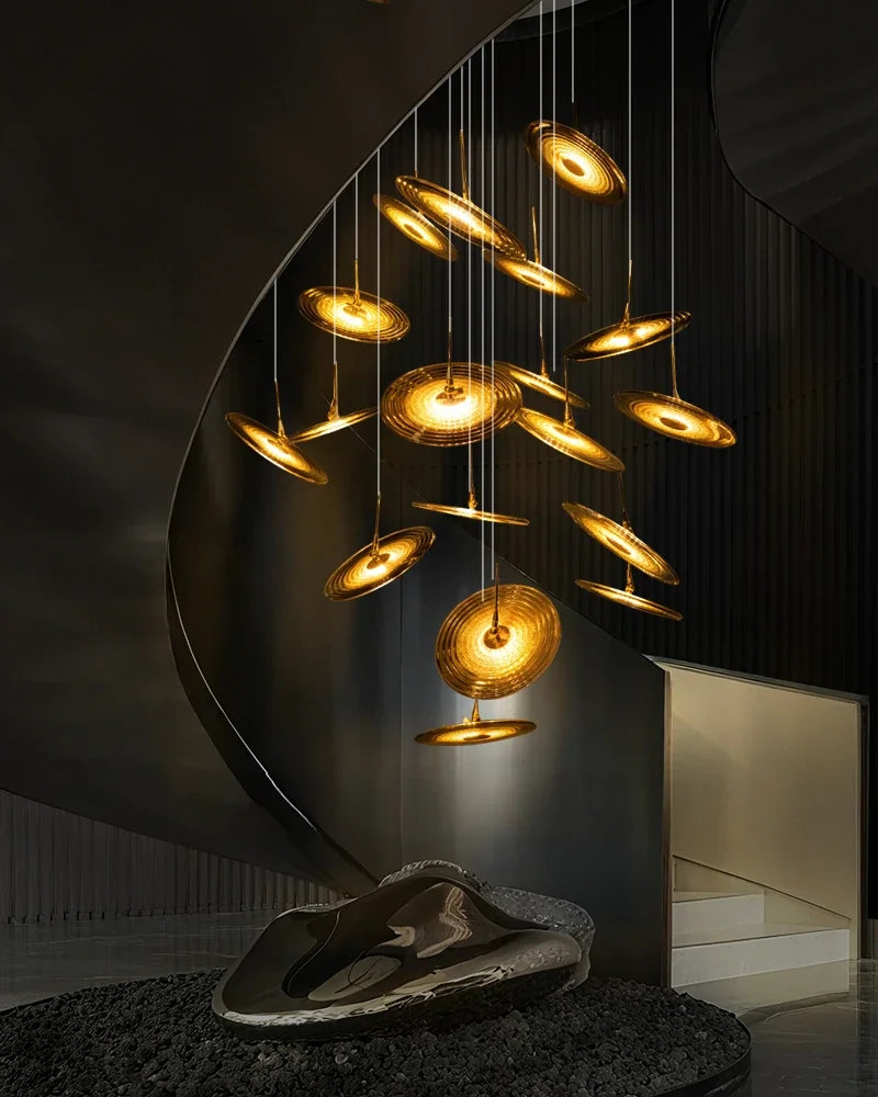 Spiral glass staircase chandelier with elements turning as they descend