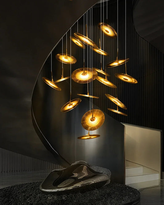 Spiral glass staircase chandelier with elements turning as they descend