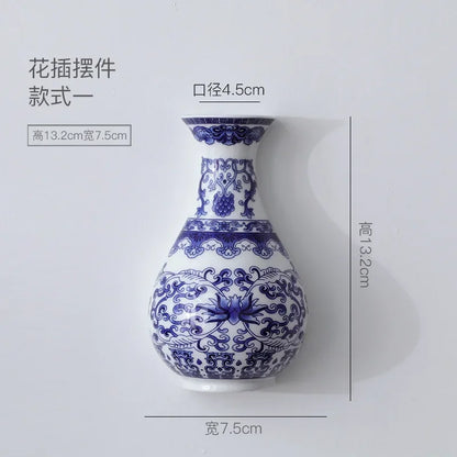 Style A blue white ceramic wall vase 13cm tall on neutral background