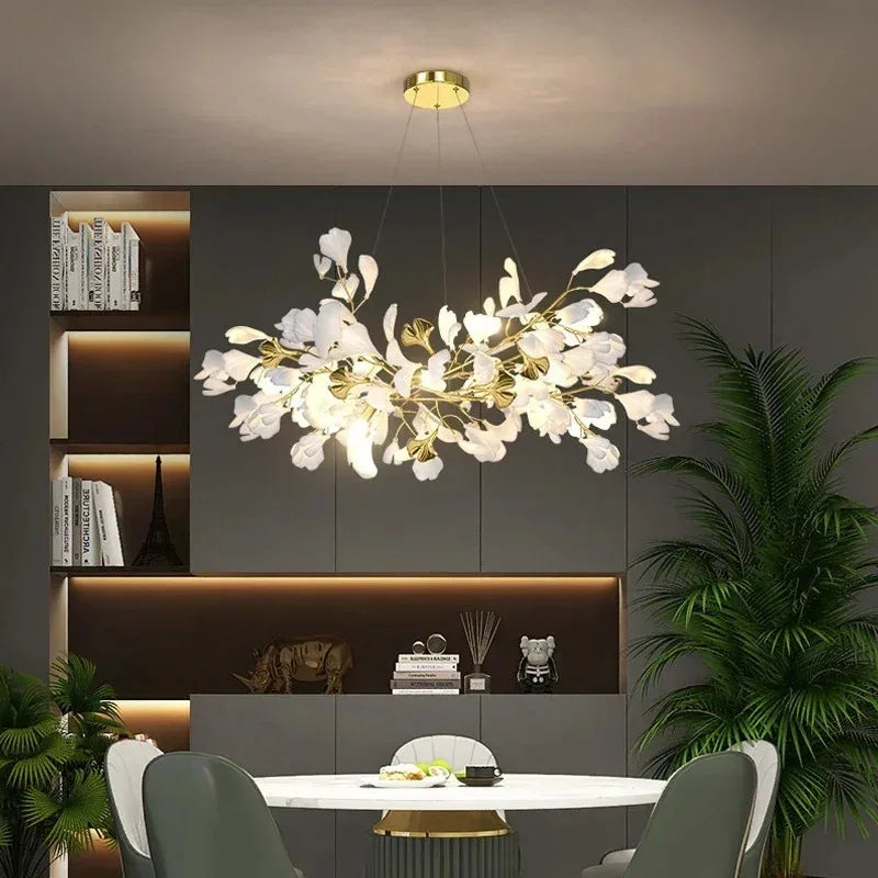 Acrylic ginkgo leaf chandelier mounted on a slim silver aluminum frame