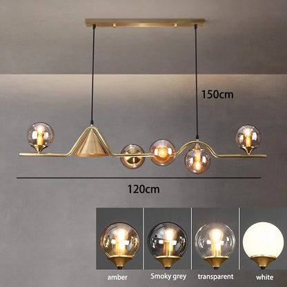 Amber glass head detail on a linear ironwork ceiling chandelier