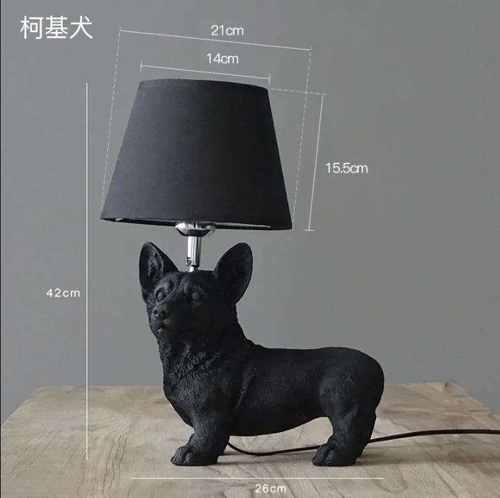 Novelty puppy dog lamp glowing in dark room on bedroom shelf