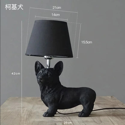 Novelty puppy dog lamp glowing in dark room on bedroom shelf