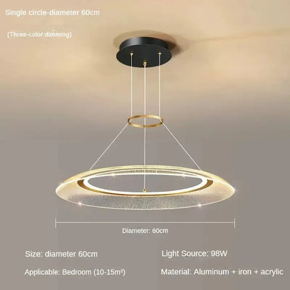 Spiral ring chandelier shown lit in warm three color light setting