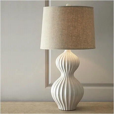 Country white ceramic lamp switched off showing clean minimal form