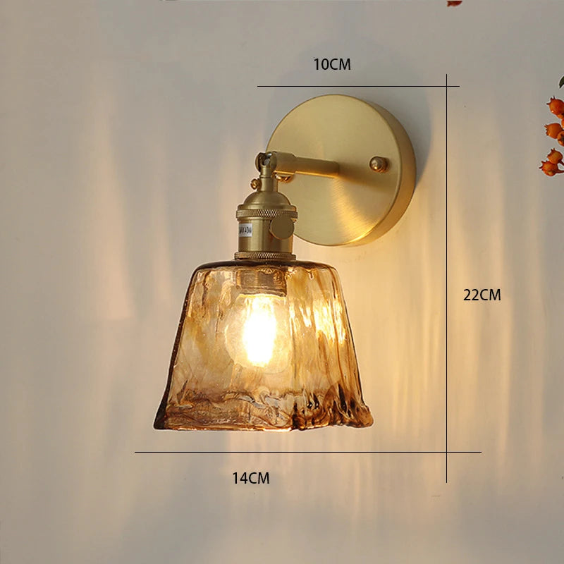 brass wall sconce, detail view of fixture base and arm