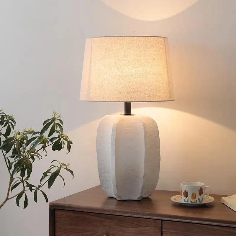 Handmade clay pottery table lamp in black finish on study desk