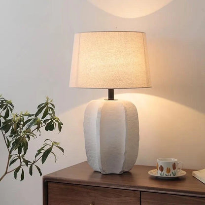 Handmade clay pottery table lamp in black finish on study desk