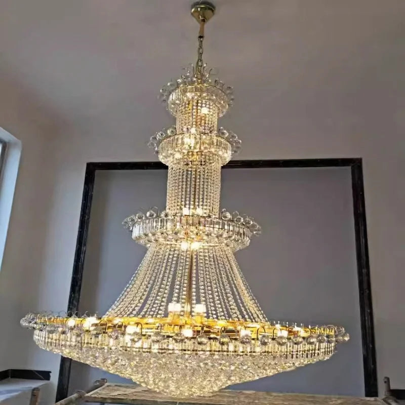 Crystal tiers in natural light on a plated gold iron chandelier frame