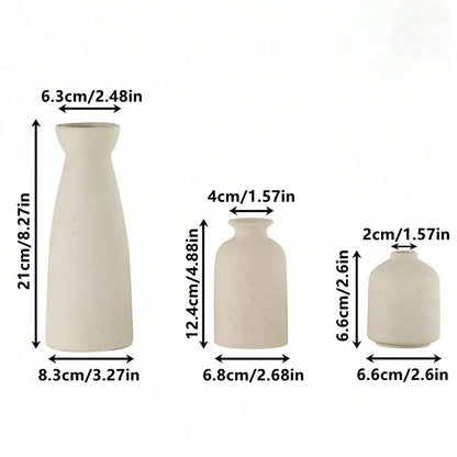 Three-piece boho ceramic vase set holding dried pampas and eucalyptus