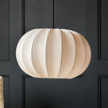 Pleated fabric pumpkin chandelier with a ribbed cloth shade on a cord