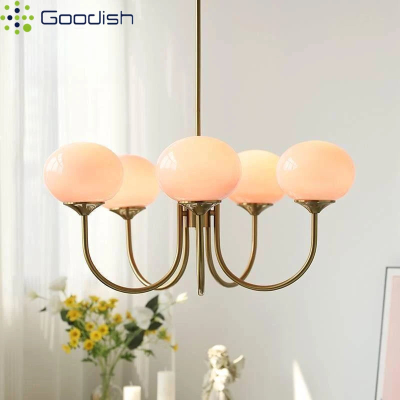 Five head frosted glass ball chandelier in a gold toned polished finish