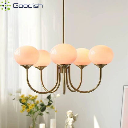 Five head frosted glass ball chandelier in a gold toned polished finish