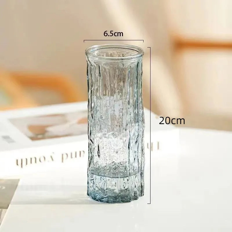 Four glacier glass vase variants arranged in a flat lay comparison display