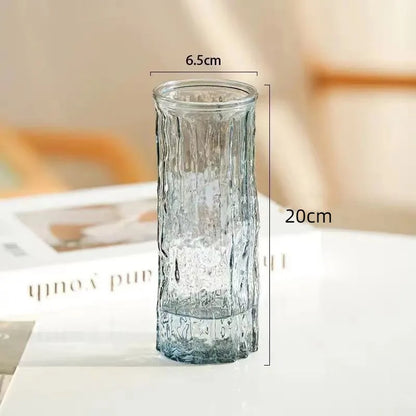 Four glacier glass vase variants arranged in a flat lay comparison display