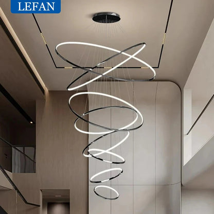 Stacked ring staircase chandelier in gold with forged aluminum rings