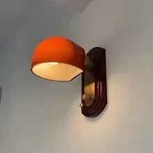 glass wall sconce, installed in a room interior setting