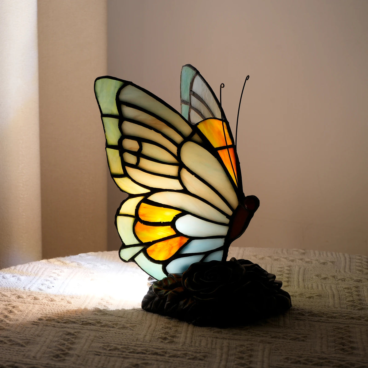 Blue butterfly glass lamp US plug variant switched on warm view